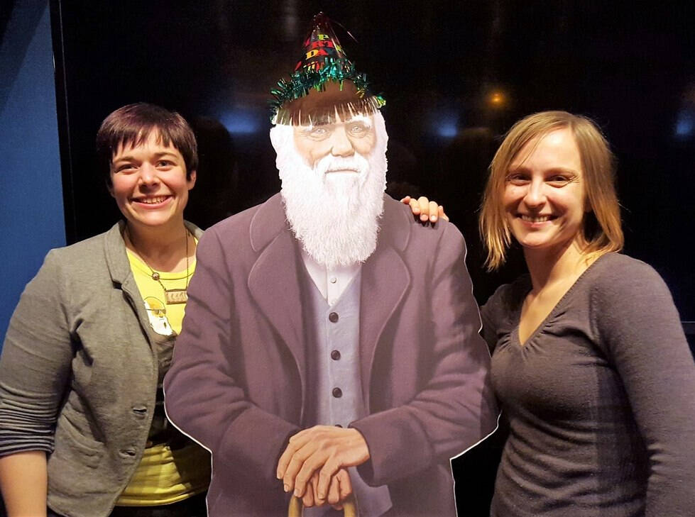 Two Science on Tap participants with a cardboard model of Charles Darwin